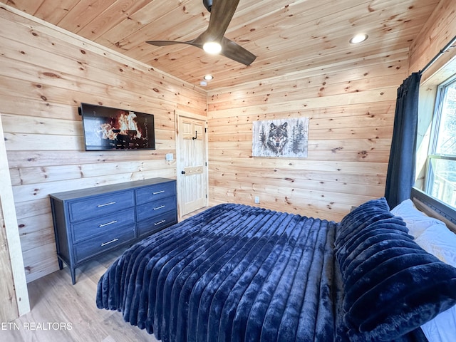 bedroom featuring recessed lighting, wood walls, a ceiling fan, wood ceiling, and light wood-style floors