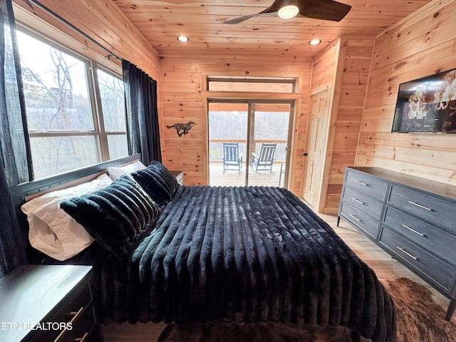 bedroom with wooden walls, wood ceiling, and access to exterior