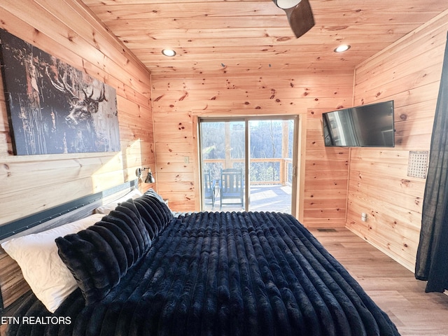 bedroom featuring wooden ceiling, access to outside, wood finished floors, and wood walls