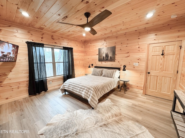 bedroom with recessed lighting, wood ceiling, wooden walls, and light wood finished floors