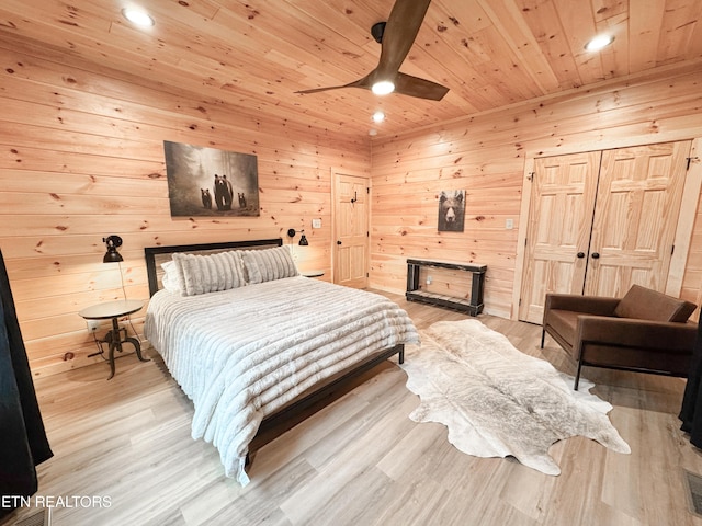 bedroom with wood ceiling, ceiling fan, light wood-type flooring, wood walls, and recessed lighting