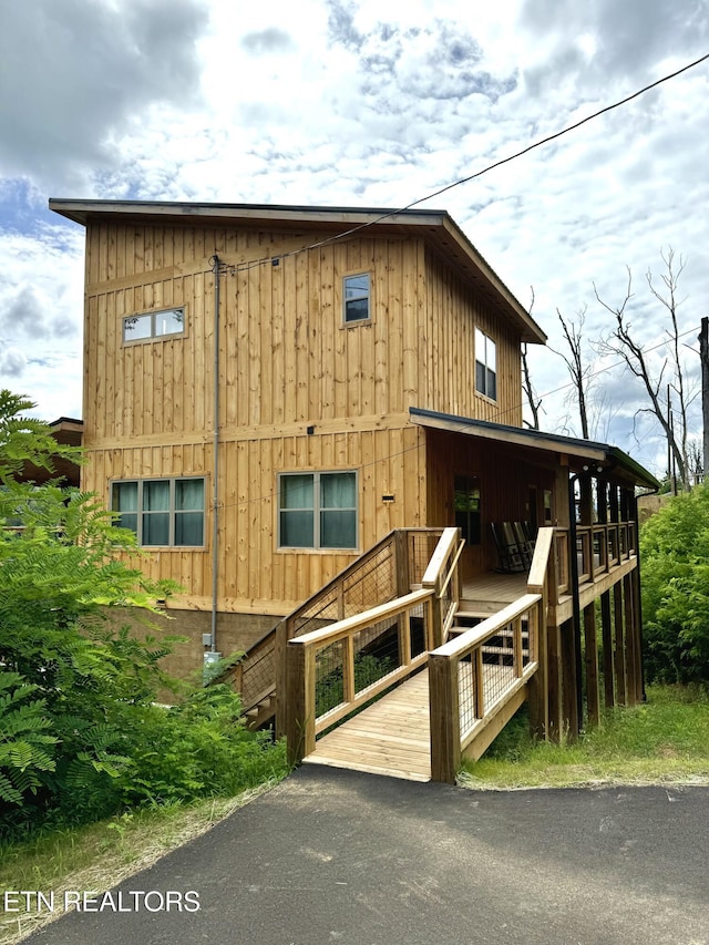 view of front of home featuring stairway