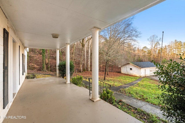 view of patio with a porch and an outdoor structure