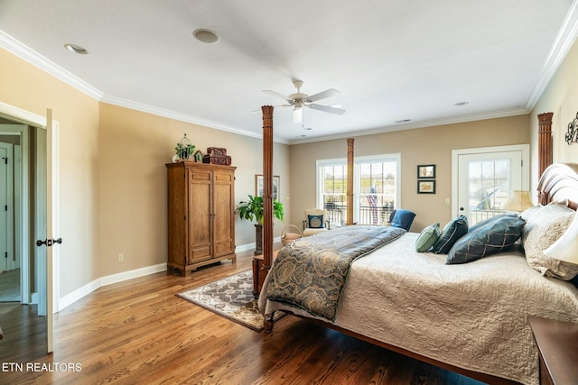 bedroom with crown molding, wood-type flooring, and access to exterior