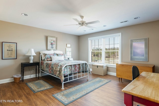 bedroom with wood-type flooring and ceiling fan