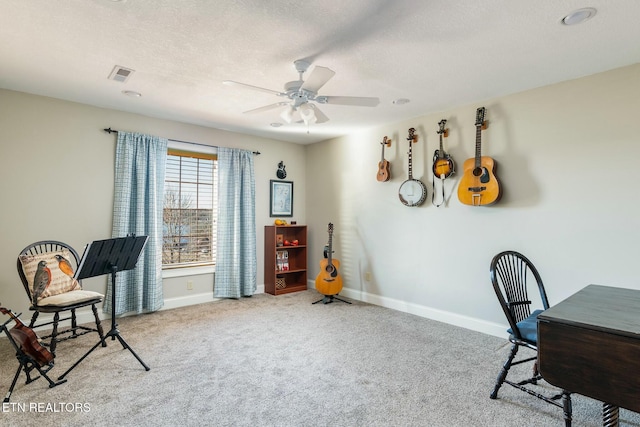 office with ceiling fan, light carpet, and a textured ceiling