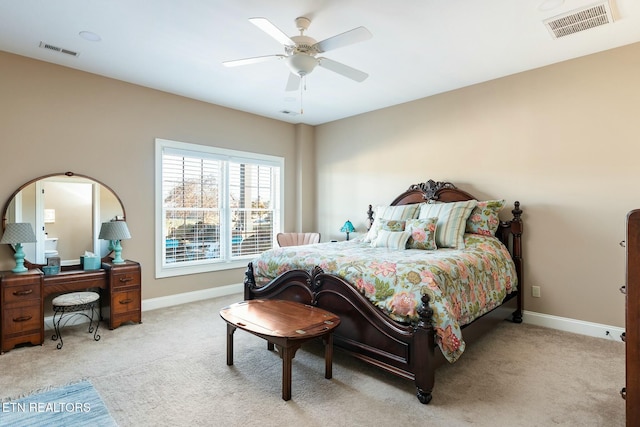 bedroom featuring light carpet and ceiling fan