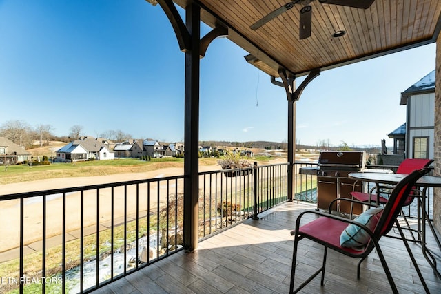 balcony featuring a grill and ceiling fan