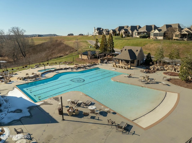 view of swimming pool featuring a patio area