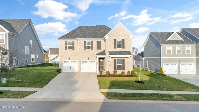 view of front of house featuring a garage and a front yard