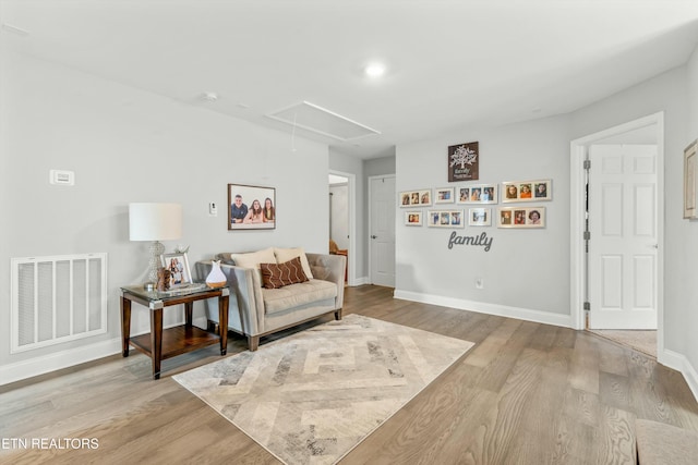 living area with light hardwood / wood-style floors