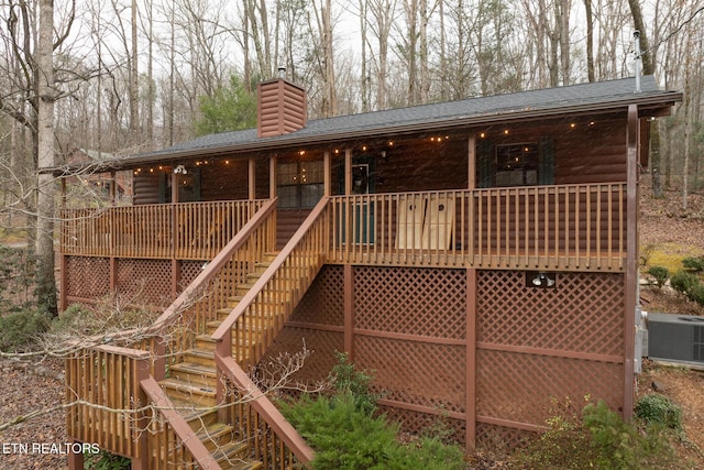 rear view of house with a porch and central AC unit