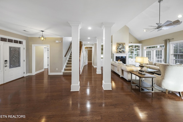 unfurnished living room with dark hardwood / wood-style floors, vaulted ceiling, and ceiling fan