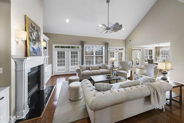 living room featuring french doors, dark hardwood / wood-style flooring, high vaulted ceiling, and ceiling fan