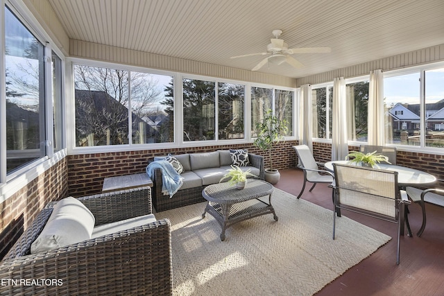 sunroom / solarium featuring ceiling fan