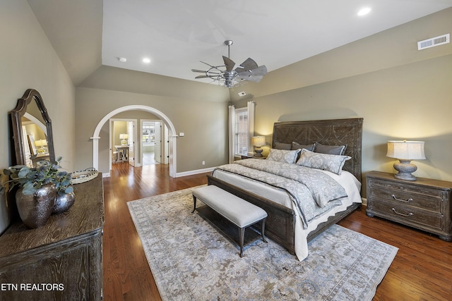 bedroom featuring dark hardwood / wood-style flooring, ceiling fan, and lofted ceiling