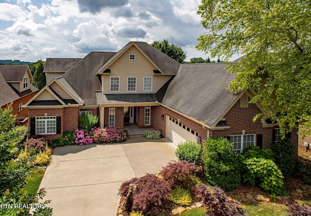 12738 Edgebrook Way, Knoxville, TN 37922 - view of front of home featuring brick siding, concrete driveway, an attached garage, roof with shingles, and a porch