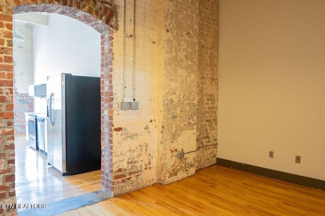 unfurnished room featuring hardwood / wood-style flooring