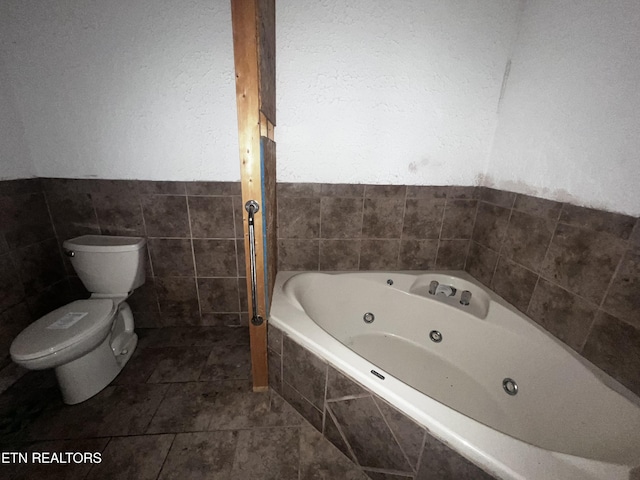 bathroom with tiled bath and toilet