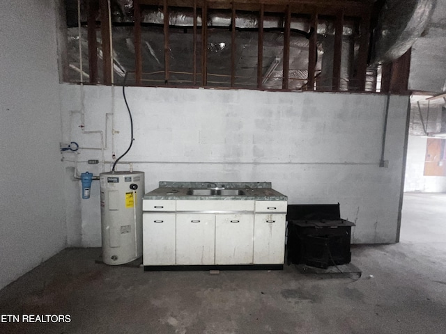 basement with water heater and sink