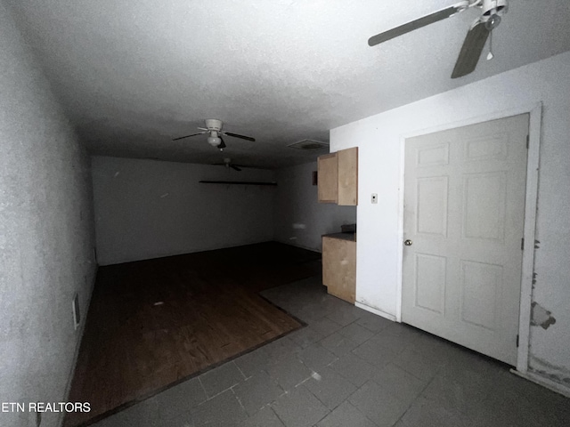 unfurnished room featuring a textured ceiling