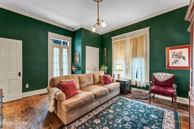 living room featuring crown molding, a notable chandelier, dark hardwood / wood-style flooring, and french doors