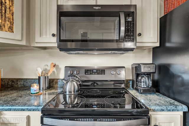 kitchen with stainless steel appliances and stone countertops