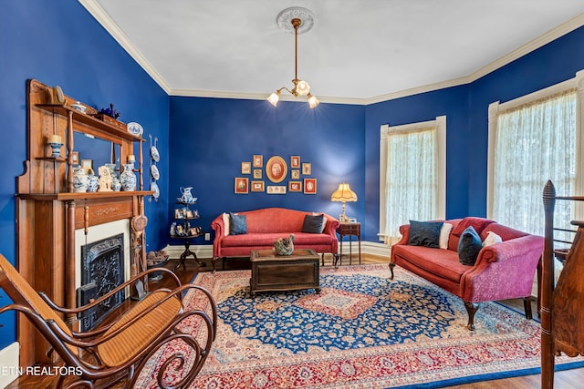 living room featuring an inviting chandelier, wood-type flooring, and ornamental molding