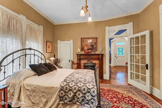 bedroom featuring crown molding and wood-type flooring