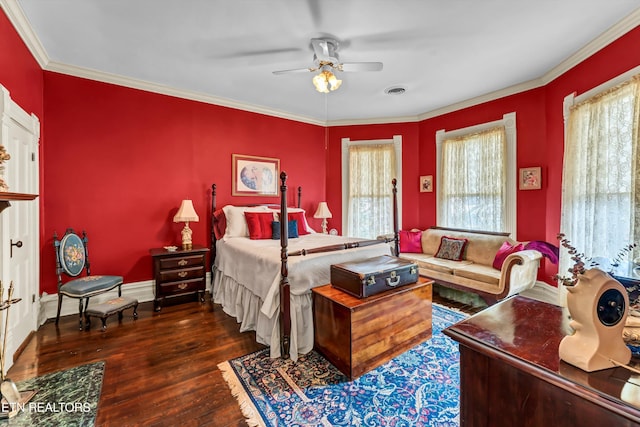 bedroom featuring multiple windows, crown molding, ceiling fan, and dark hardwood / wood-style flooring