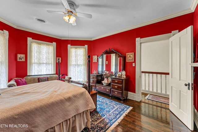 bedroom featuring crown molding, ceiling fan, and dark hardwood / wood-style floors