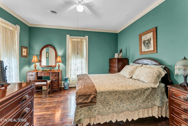 bedroom with ceiling fan, ornamental molding, and dark hardwood / wood-style flooring