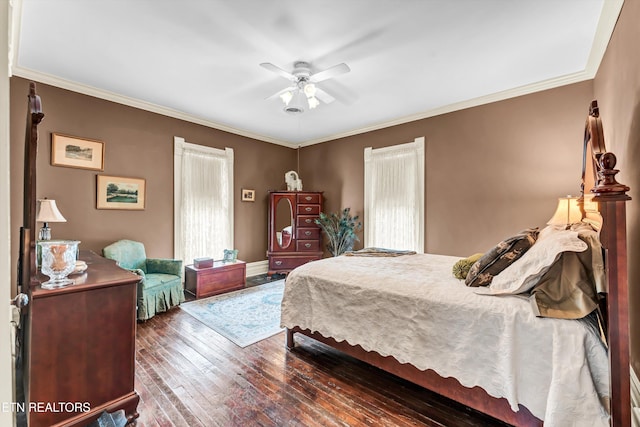 bedroom with crown molding, ceiling fan, and dark hardwood / wood-style flooring