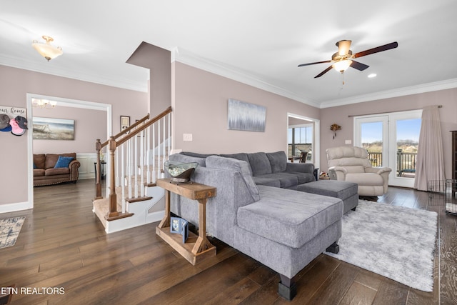 living room with crown molding, ceiling fan, and dark wood-type flooring