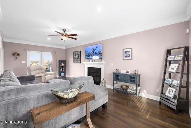 living room with ceiling fan, dark hardwood / wood-style flooring, and crown molding