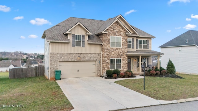 craftsman house with a porch, a garage, and a front yard