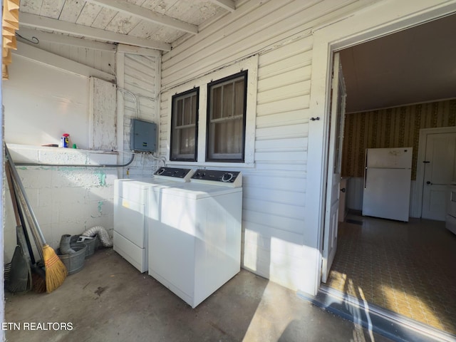 washroom with laundry area and washer and dryer