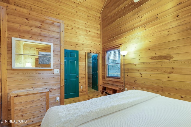 bedroom with wooden walls