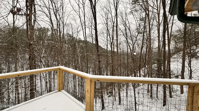 view of snow covered deck