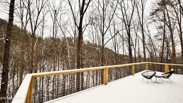 view of snow covered deck