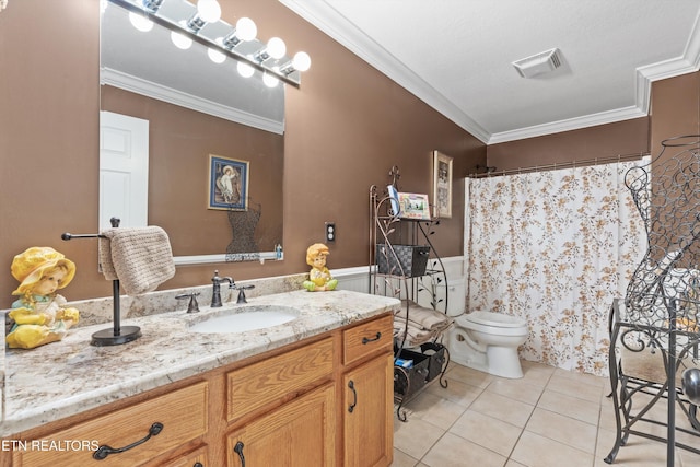 bathroom with a textured ceiling, vanity, crown molding, tile patterned flooring, and toilet