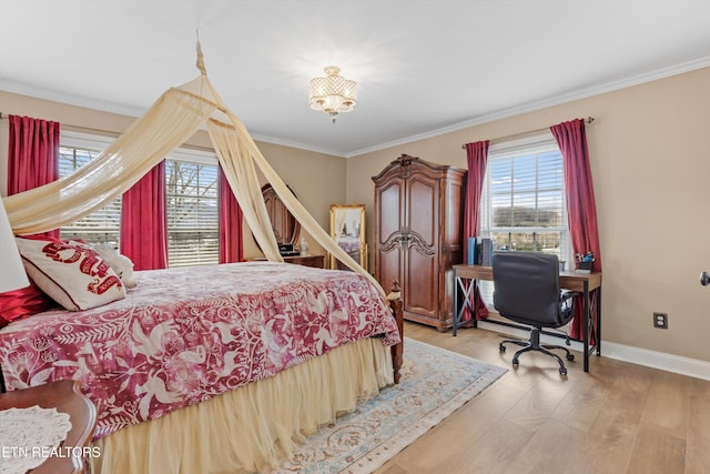 bedroom with light hardwood / wood-style floors and ornamental molding