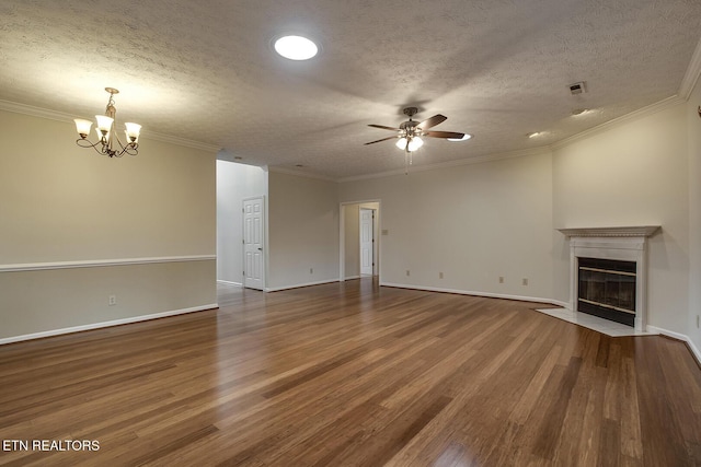 unfurnished living room with a textured ceiling, dark hardwood / wood-style flooring, and crown molding