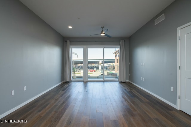 unfurnished room with ceiling fan and dark hardwood / wood-style flooring