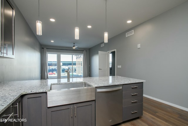 kitchen featuring dishwasher, light stone counters, ceiling fan, hanging light fixtures, and dark hardwood / wood-style flooring