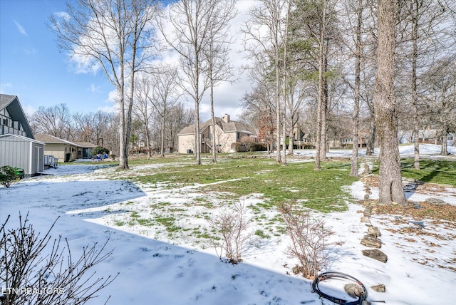 view of yard covered in snow