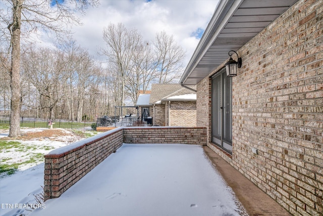 view of snow covered patio