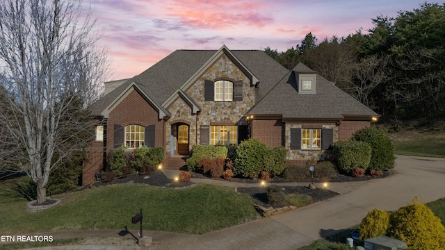 view of front of house with a yard