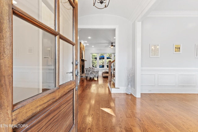 entryway featuring lofted ceiling, french doors, hardwood / wood-style floors, and ceiling fan with notable chandelier