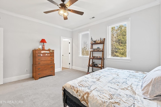 bedroom with light colored carpet, ceiling fan, and crown molding